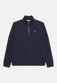 Sudadera azul marino con cuello tipo perkins con cremallera, cremallera plateada y puños acanalados. Presenta un pequeño logo bordado en el pecho. Textura suave.