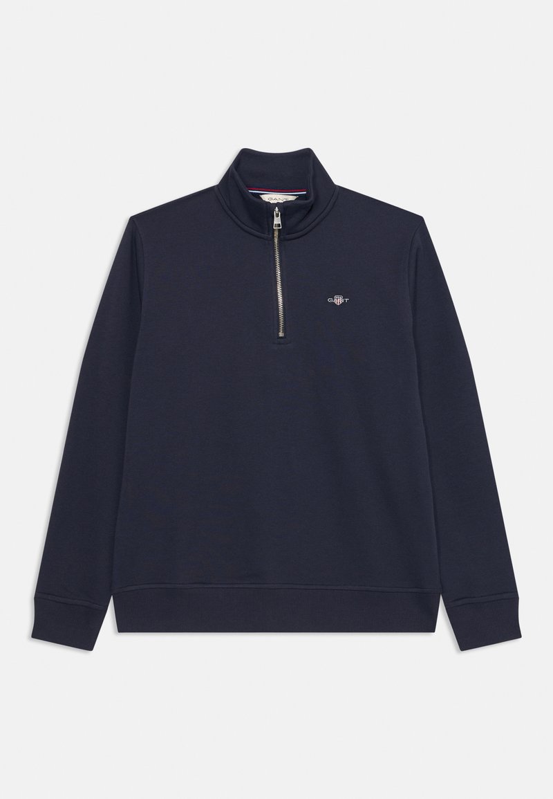 Sudadera azul marino con cuello tipo perkins con cremallera, cremallera plateada y puños acanalados. Presenta un pequeño logo bordado en el pecho. Textura suave.