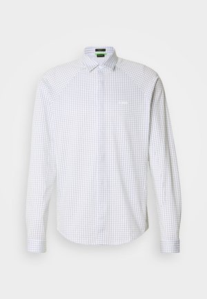 Chemise à manches longues boutonnée blanche avec un motif à carreaux bleus. Dotée d'un col classique et d'une poche frontale. Tissu lisse avec une coupe structurée.