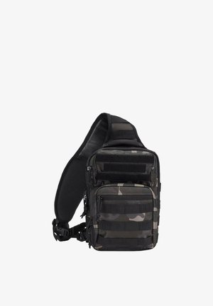 Kompaktne musta ja halli kamuflaažiga taktikaline vöökott mitme lukuga tasku ja reguleeritava polsterdatud õlarihmaga.