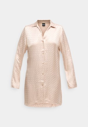 Hedvábná košeľa s dlhým rukávom v svetlej béžovej farbe so subtílnym geometrickým vzorom, s gombíkovým zapínaním a klasickým golierom. Hladká textúra s jemne lesklým povrchom.