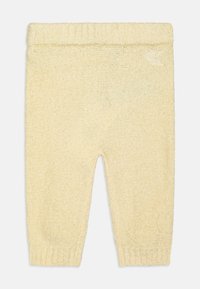 Pantalon en tricot jaune avec une texture douce, présentant une taille et des poignets côtelés. Logo brodé à l'arrière.