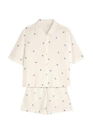 Cotton short-sleeve pajama set in off-white with a buttoned top and matching shorts. Features small blue floral patterns.