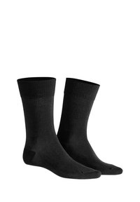 Schwarze Baumwollsocken mit geripptem Muster, Höhe bis zur Mitte der Wade und verstärkter Zehenpartie. Einfaches Design ohne Muster oder Akzente.