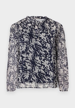 Blusa navy con estampado floral en blanco, con escote plisado y mangas largas, sobre un fondo blanco liso.