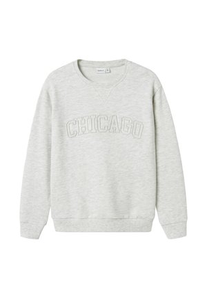 Helehall hall sweatshirt pehmest materjalist, millel on tekstuuriga "CHICAGO" graafika rinnal. Ribidega mansetid ja alläär. Klassikaline ümmargune kaelus.