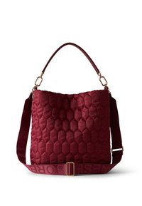 Red quilted handbag with a hexagonal pattern, featuring a short handle and a long adjustable strap with a logo, accented by gold hardware.