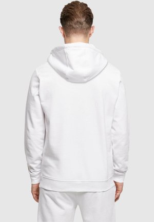 Hvid hættetrøje med lange ærmer, en afslappet pasform og ribbede manchetter. Blød tekstur, minimalistisk design og en kængurulomme foran.