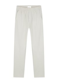 Light grey tapered pants with an elastic waistband, side pockets, and a smooth, lightweight fabric. Minimalistic design with no patterns.