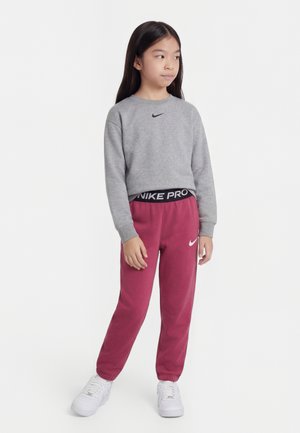 Nike Performance PRO JOGGER UNISEX - Pantaloni de trening - sweet beet