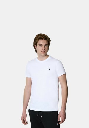 T-shirt bianco in cotone con scollatura rotonda e maniche corte, caratterizzato da un piccolo logo nero sul lato sinistro del petto. Design semplice e aderente.
