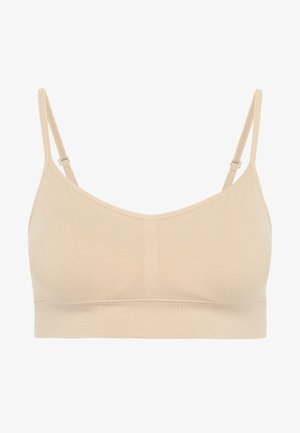 Beige bralette met verstelbare banden, naadloos ontwerp, zachte textuur en een effen, gladde afwerking. Geen onderdraad of vulling zichtbaar.