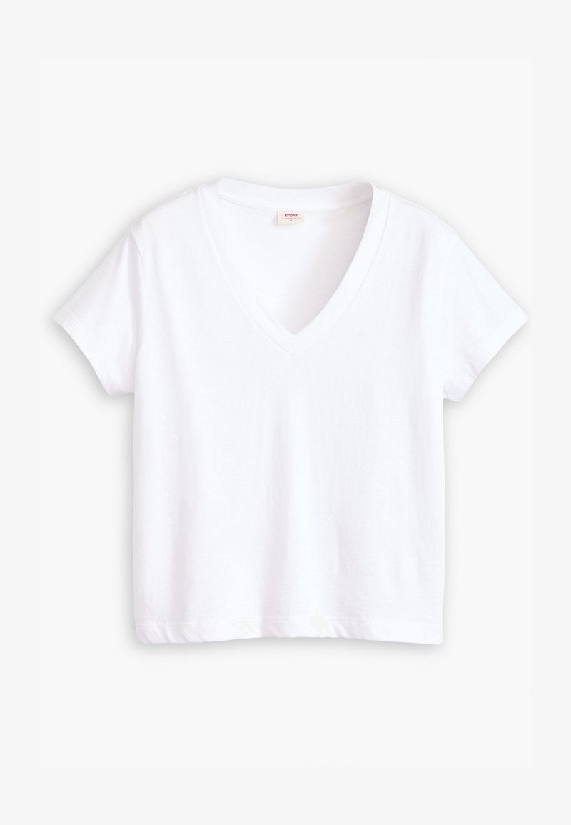 Camiseta blanca de algodón con escote en V, mangas cortas y dobladillo recto. Textura suave, diseño minimalista, sin estampados ni acentos.