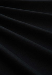 Black fabric with a smooth texture, featuring soft drapes and subtle sheen, displaying a uniform color and no visible patterns or accents.