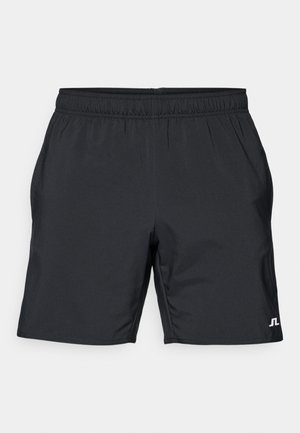 Pantaloni sportivi neri con vita elastica, tasche laterali e accento logo bianco. Realizzati in tessuto leggero e liscio.
