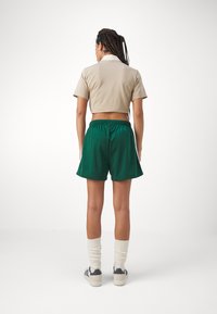 adidas Originals FIREBIRD - Trainingsbroek - collegiate green