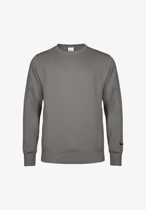 Grauer Nike-Sweatshirt mit langen Ärmeln, Rundhalsausschnitt und gerippten Bündchen und Saum, mit kleinem schwarzem Nike-Logo im Bereich des linken Handgelenks.