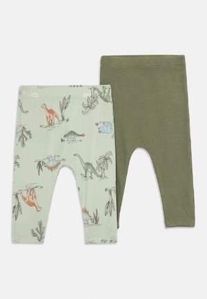 Two pairs of toddler leggings, one light green with colorful dinosaur prints, the other solid olive green with a textured pattern.