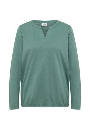 Teal long-sleeve top with a V-neckline and soft texture. Features a relaxed fit and elastic hem for comfort. Tag reads "CECIL".