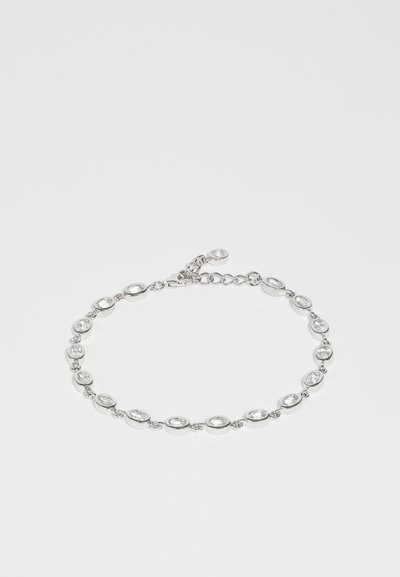 Silver bracelet featuring oval, transparent gemstones, alternating with polished metal links. Includes an adjustable chain for sizing.