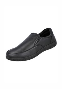 Zapatos sin cordones de cuero negro con textura suave, punta redondeada, paneles laterales elásticos y suela de goma con ranuras horizontales.