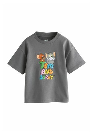 T-shirt gris pour enfant avec le texte coloré « Tom et Jerry » et les visages de dessin animé de Jerry la souris et Tom le chat au-dessus.