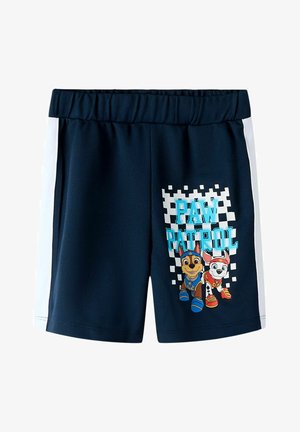 Tmavomodré detské šortky s bielymi bočnými pásmi, na pravom stehennej časti s postavičkami Chase a Marshall z Paw Patrol a nápisom "PAW PATROL".