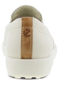 White leather slip-on shoe with a textured surface, featuring a tan accent at the heel and a rubber sole. Simple, clean design.