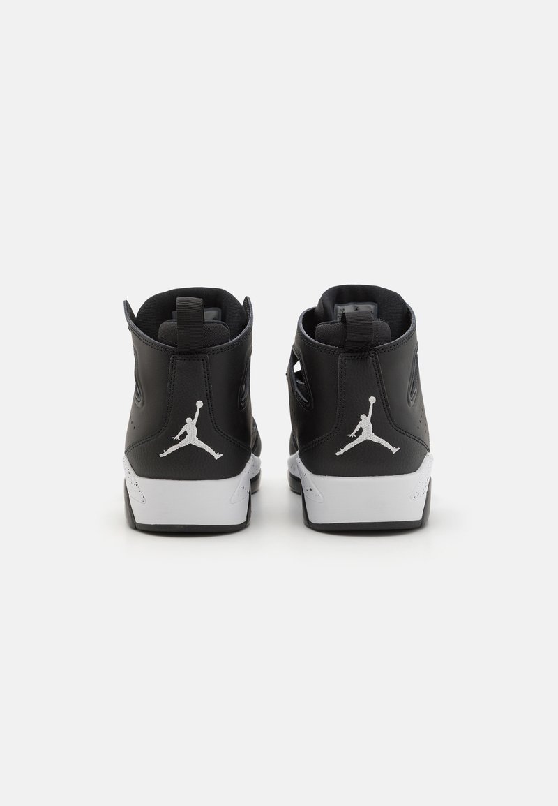 Baskets montantes noires avec tige en cuir, semelle intermédiaire blanche et logo Jumpman au talon. Comprend un col rembourré et un support de cheville.