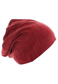Red slouchy beanie made of soft, textured fabric with a crinkled appearance, featuring a loose fit at the top and a smooth edge.