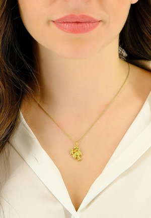 Collier en or avec un pendentif en forme de homard, finement conçu avec des griffes et un corps détaillés, suspendu à une fine chaîne.