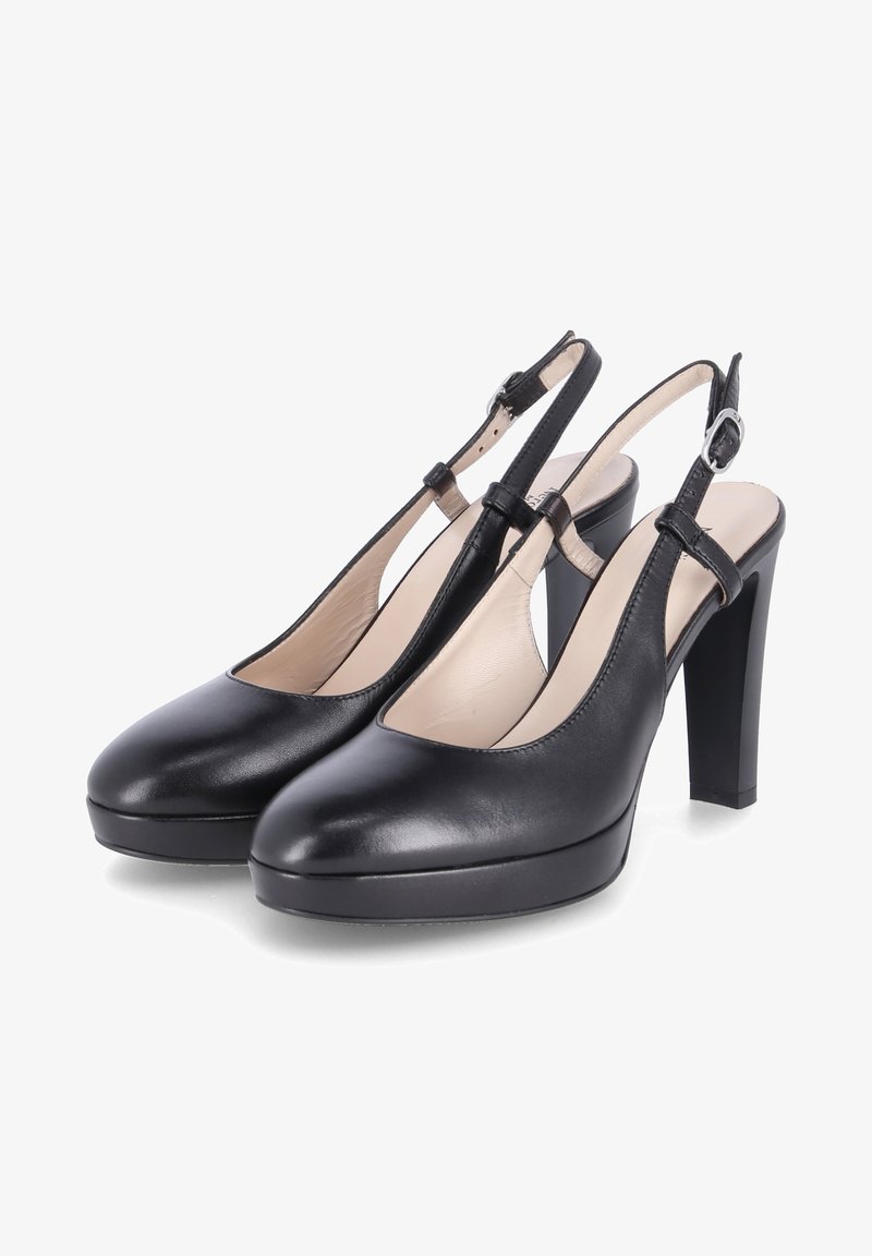Escarpins slingback en cuir noir avec bout rond, bride de cheville réglable et talon épais bloc sur fond blanc.