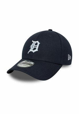 Dark blue baseball cap with white embroidered letter D on front and small logo on side, small-medium size label on the brim.