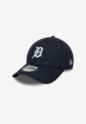 Dark blue baseball cap with white embroidered letter D on front and small logo on side, small-medium size label on the brim.