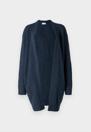 Cardigan oversize bleu marine, fabriqué en tissu tricot doux. Design à ouverture devant, manches longues, poignets côtelés et texture lisse sans motifs.