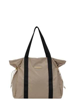 Beige nylon tote bag with black logo straps, featuring a gold-tone plaque, cinched sides, and textured fabric for added depth.