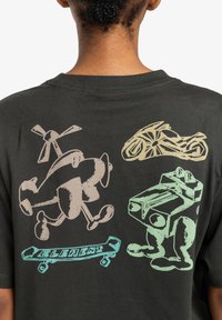 Black cotton t-shirt featuring colorful cartoon graphics: a helicopter, a motorcycle, and a character with a boxy body.