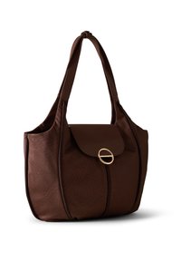 Brown textured leather tote bag with a flap closure, a circular gold accent, and dual shoulder straps. Features a spacious interior.