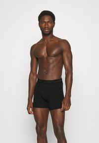 Calvin Klein Underwear TRUNK 3 PACK COTTON STRETCH - Cuecas boxer - black
