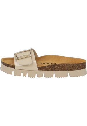 Beige slide sandals with a glossy strap featuring a square buckle. Cork footbed and textured rubber sole provide comfort and traction.