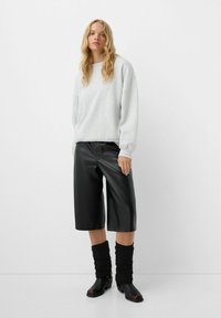 Bershka Lábmelegítők - black