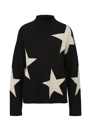 Pull noir à manches longues avec de grands motifs d'étoiles blanches et un col haut côtelé.