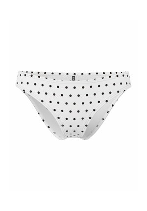 Sous-vêtement style bikini blanc avec de petits pois noirs régulièrement espacés, bords sans coutures et taille basse.