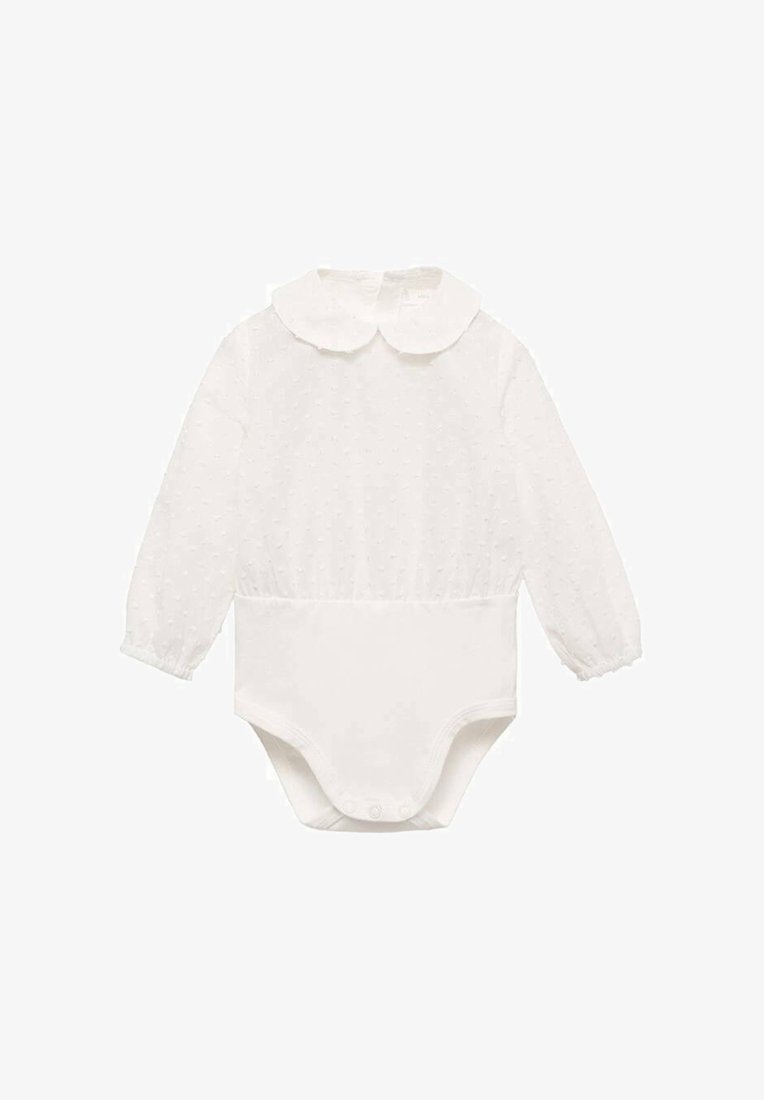 Bela dolga majica z dolgimi rokavi s pikčasto teksturo, okroglo ovratnico in gumbi na dnu za enostavno oblačenje. Mehka tkanina.