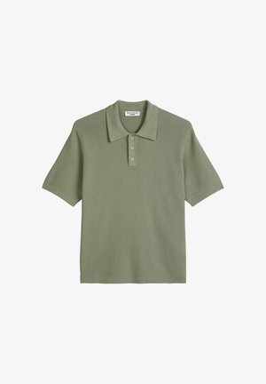 Light green short-sleeve knit polo shirt with three buttons and a textured pattern, labeled Marc O'Polo Denim.
