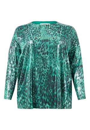 Grøn top med paljetter, der har en løs pasform, lange ærmer og et leopardmønster. Stoffet har en skinnende, tekstureret overflade.