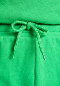 Modström HOLLY PANTS - Calças de fato de treino - island green