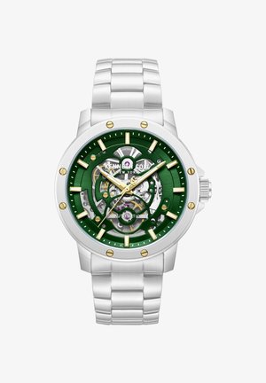 Zilverkleurig metalen horloge met een groen skeletuurwerk, gouden uurmarkeringen en wijzers die 10:09 aangeven, merk Kenneth Cole New York, automatische beweging zichtbaar.