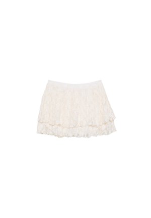 Mini gonna bianca in pizzo con un design a strati, caratterizzata da una superficie testurizzata e una vita elasticizzata per il massimo comfort.
