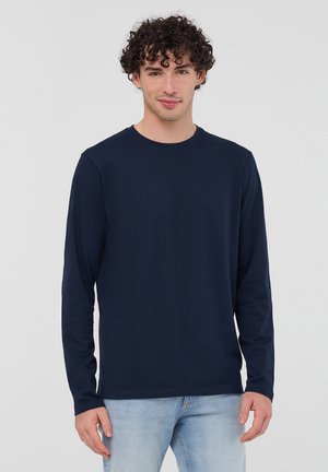 - Bluzka z długim rękawem